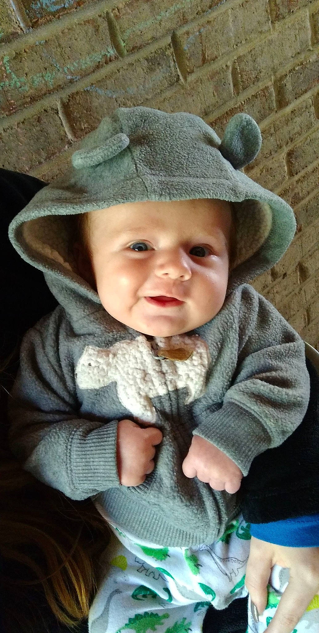Leon is registered to the contest to win money with this photo: baby, baby_toddler_clothing, cap, cheek, chin, eye, grass, happy, hat, head, headgear, headwear, iris, lip, outerwear, person, sitting, skin, sleeve, sun_hat
