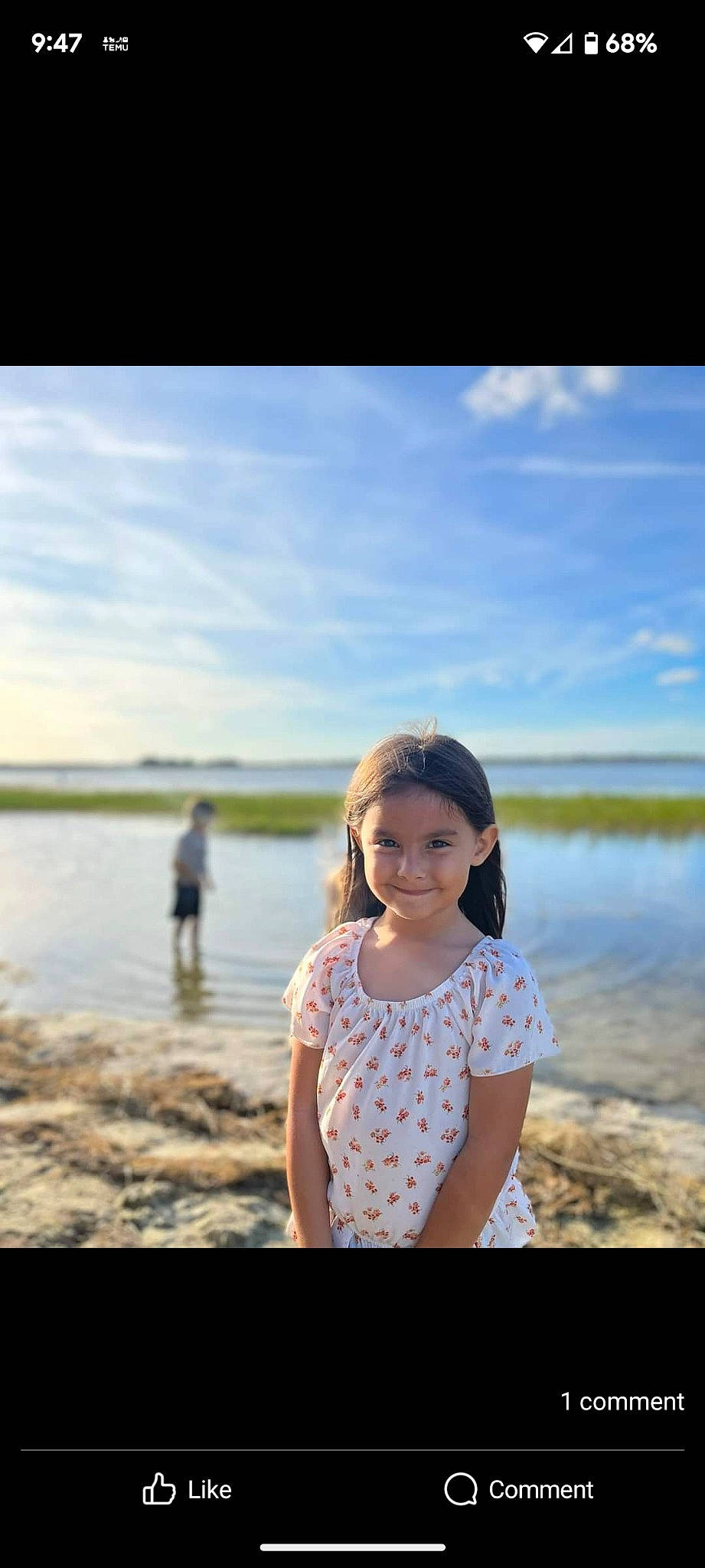 Lorelei is registered to the contest to win money with this photo: azure, beach, body_of_water, cloud, flash_photography, fun, grass, happy, horizon, joy, lake, landscape, leisure, people_in_nature, person, sand, sky, smile, standing, sunlight