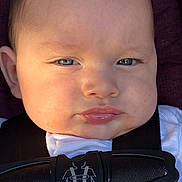 David joined the competition — help win amazing prizes! baby, blue_eyes, car_seat, child, close_up, expression, face, hair, head, indoor, infant, person, portrait, pout, safety_harness, seat, seatbelt, skin, soft_light, white_clothing