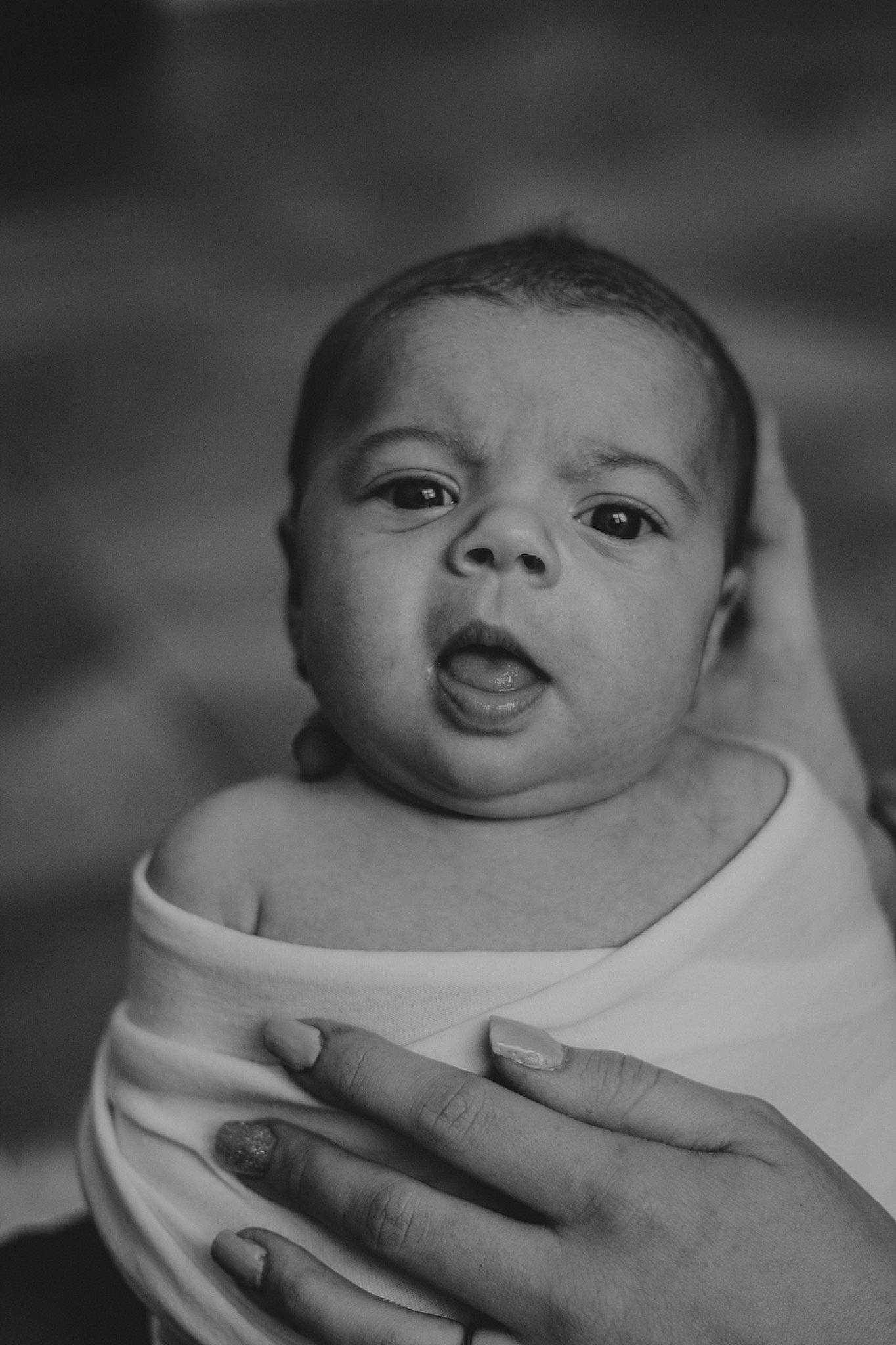 Rylei is registered to the contest to win money with this photo: baby, black, black_and_white, cheek, child, eye, face, facial_expression, hand, head, human, lip, monochrome, monochrome_photography, people, person, photograph, skin, smile, toddler