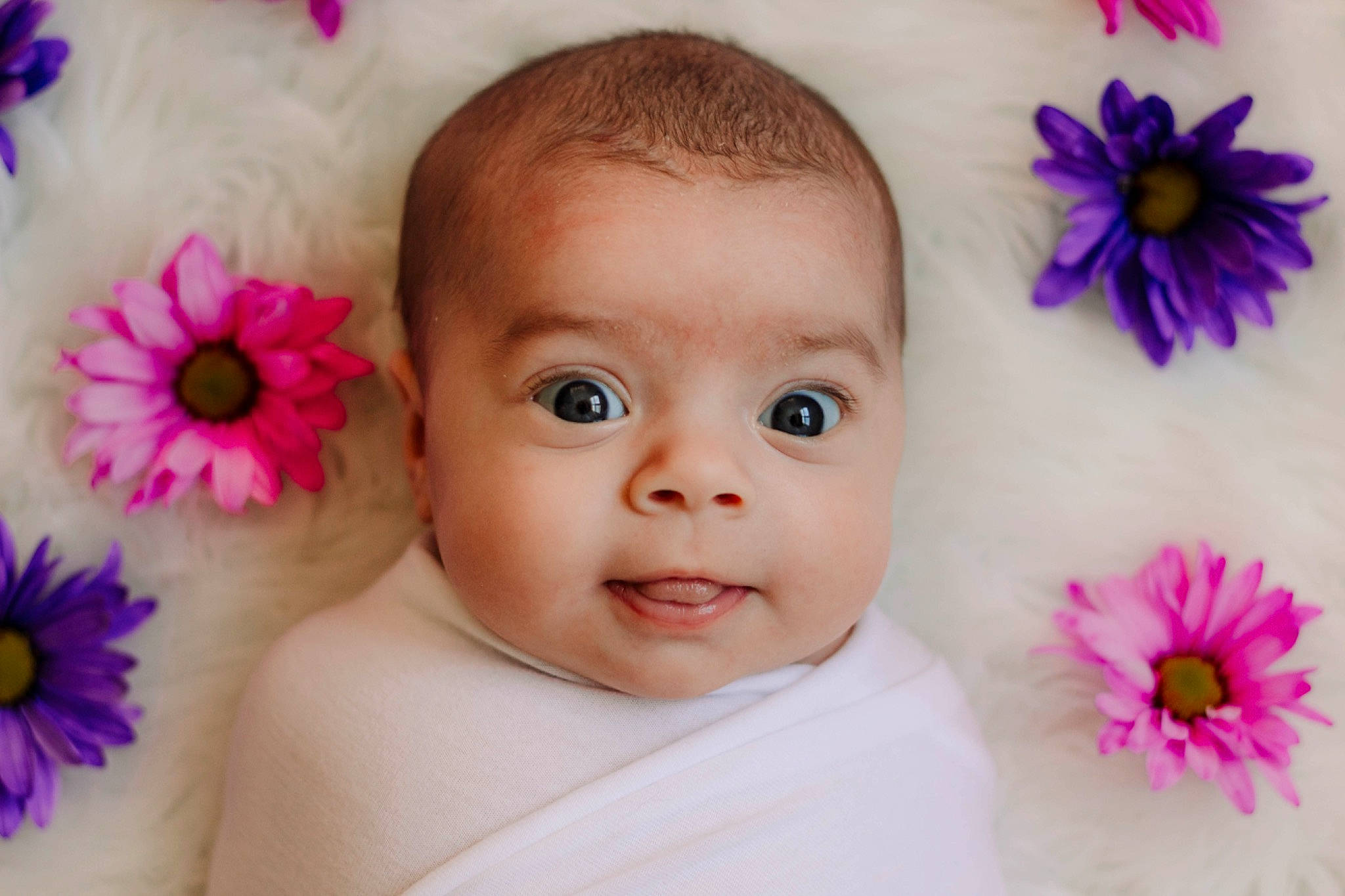 Rylei joined the competition — help win amazing prizes! baby, cheek, child, close_up, eye, face, flower, hair_accessory, head, iris, lip, mouth, nose, person, petal, photography, pink, plant, skin, smile