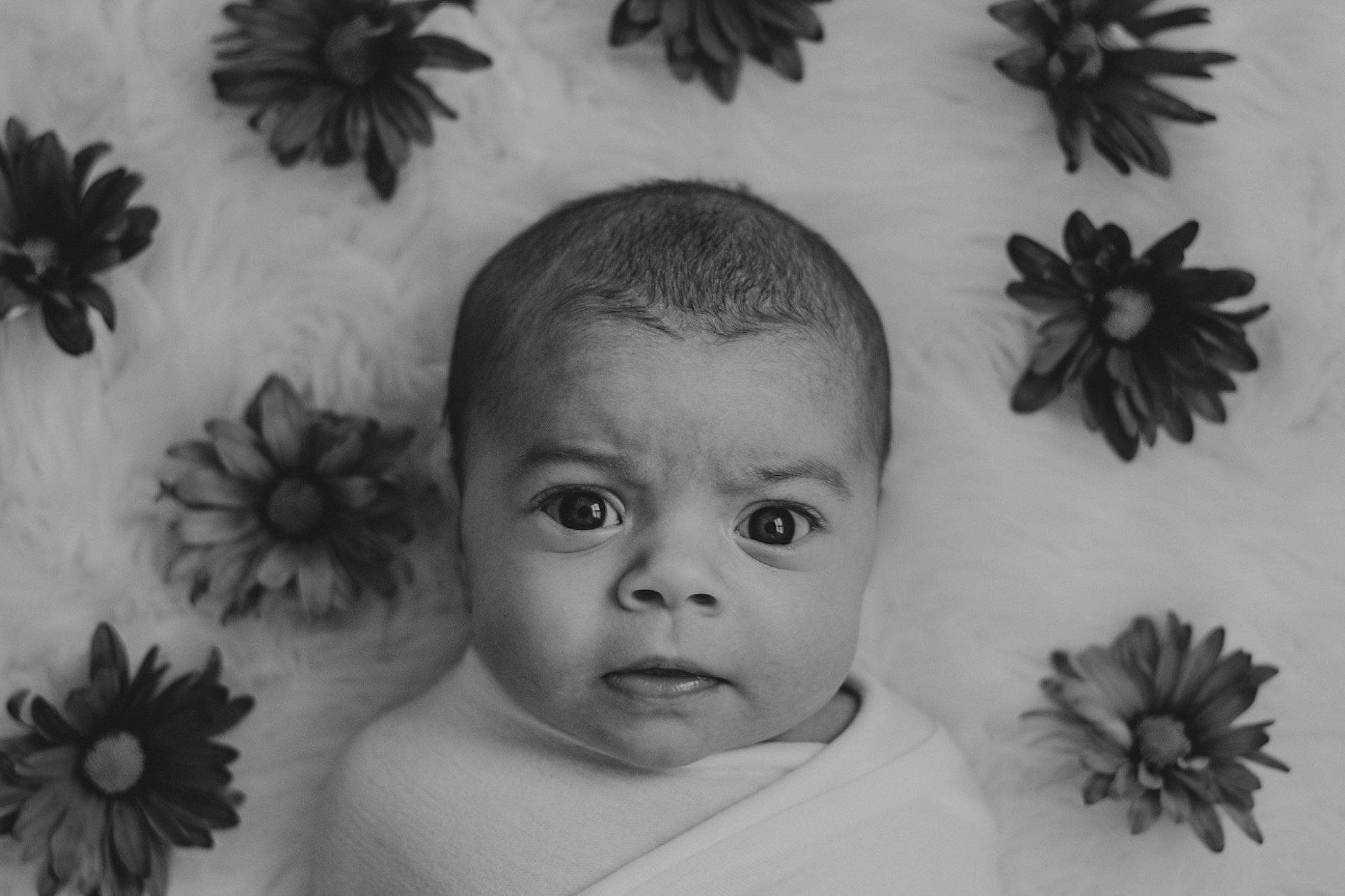 Rylei is registered to the contest to win money with this photo: baby, black_and_white, cheek, child, drawing, face, flower, head, monochrome_photography, person, photography, plant, portrait, smile, still_life_photography, toddler