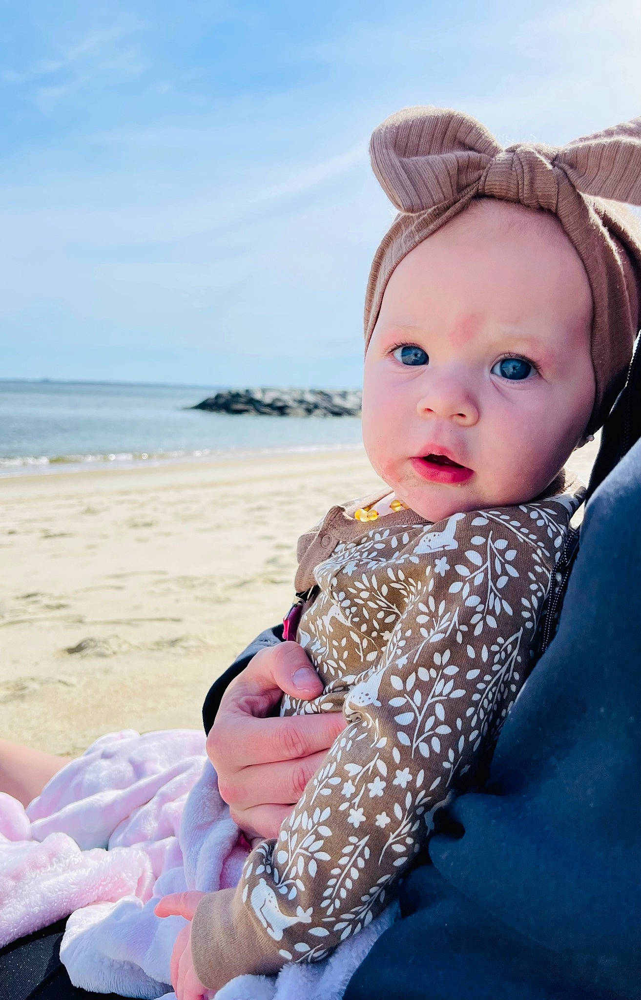 Aspen joined the competition — help win amazing prizes! azure, baby, baby_toddler_clothing, beach, cap, child, electric_blue, fashion_accessory, fun, happy, hat, ocean, pattern, people_in_nature, person, sitting, skin, sky, toddler, vacation