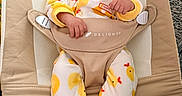 Javari joined the competition — help win amazing prizes! baby, baby_bouncer, beige, bouncer, carpet, cute, duck_pattern, duck_slippers, fabric, feet, hands, indoor, infant, legs, onesie, portrait, safety_strap, seat, smile, yellow