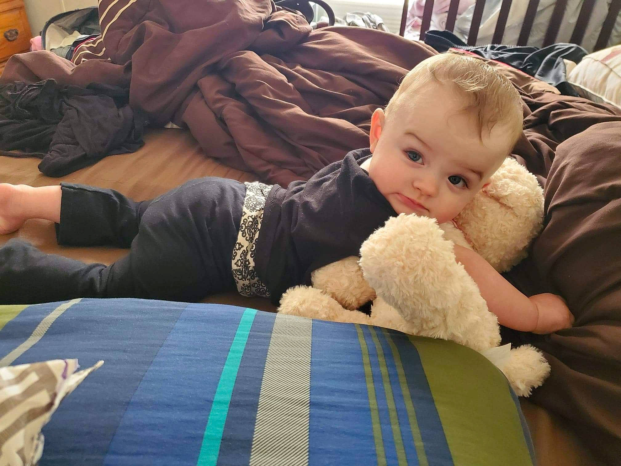 Charley Kay is registered to the contest to win money with this photo: baby, child, comfort, couch, hand, head, human, lap, nap, person, room, sitting, sleep, toddler