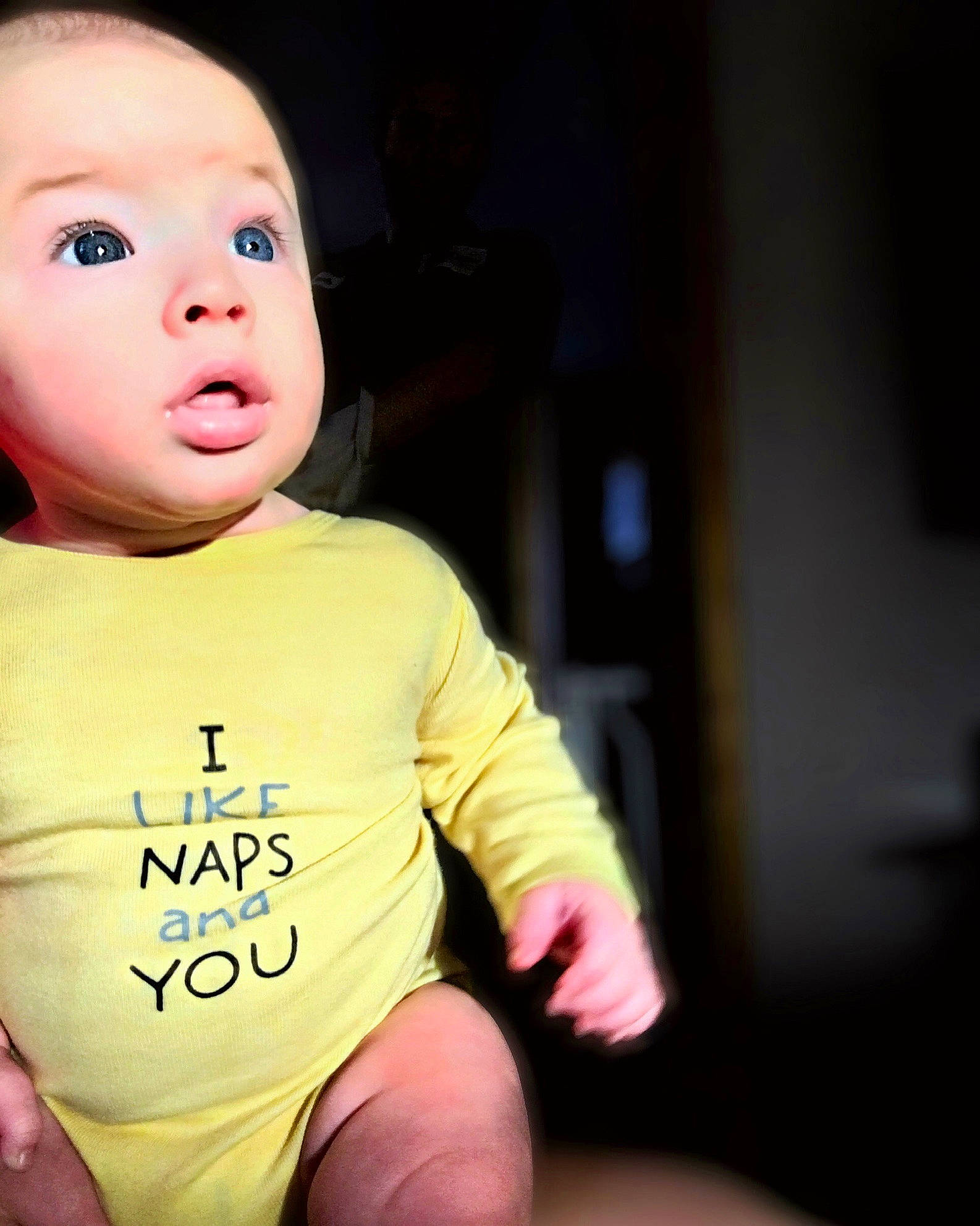 Titus is registered to the contest to win money with this photo: baby, beauty, cheek, child, chin, eye, face, finger, flash_photography, happy, human, lip, nose, person, pink, sitting, skin, smile, surprise, toddler