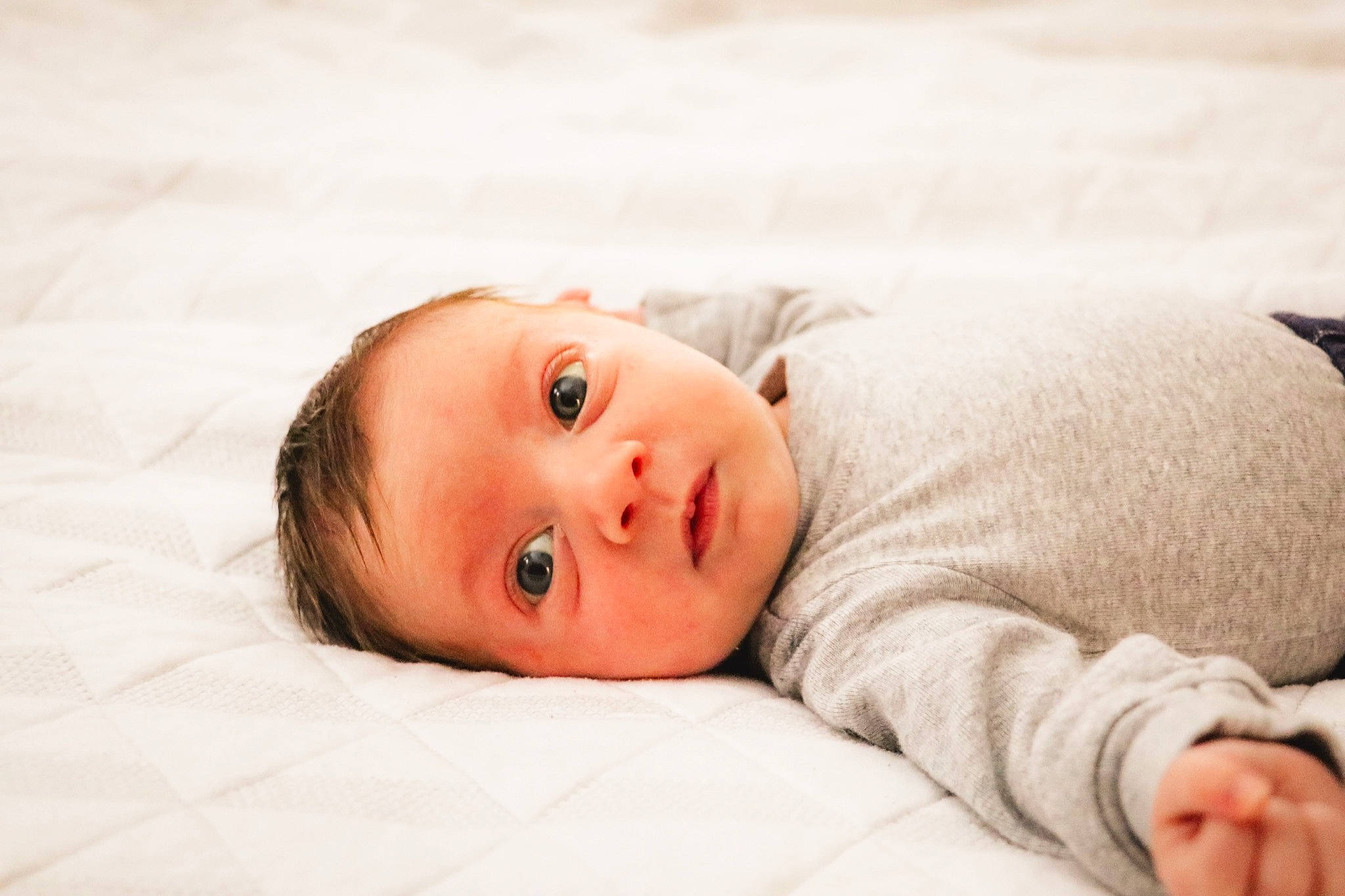 Bronson joined the competition — help win amazing prizes! baby, baby_toddler_clothing, cheek, child, collar, comfort, eye, face, flooring, head, linens, lip, nose, person, portrait_photography, room, sitting, skin, sleeve, toddler