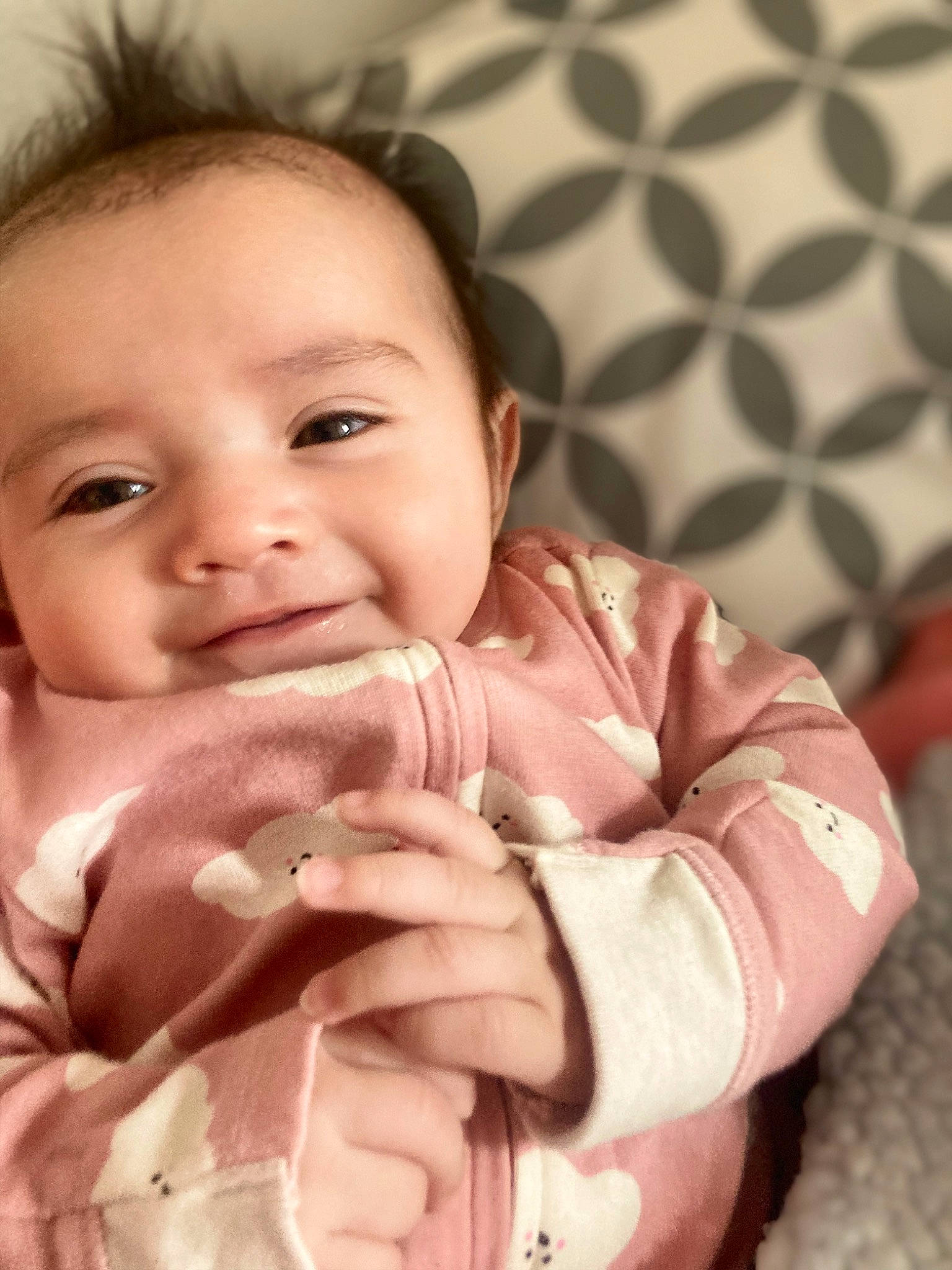 Evelia is registered to the contest to win money with this photo: baby, baby_toddler_clothing, cheek, chin, eye, eyebrow, finger, gesture, hand, happy, iris, lip, mouth, nose, person, skin, sleeve, smile, textile, thumb