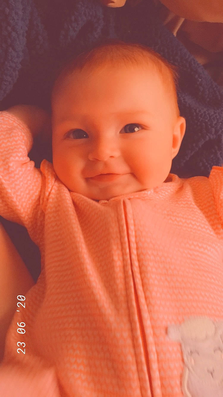 Dalilah joined the competition — help win amazing prizes! baby, baby_toddler_clothing, cheek, chin, collar, eyebrow, eyelash, forehead, gesture, human_body, iris, lip, mouth, neck, nose, person, pink, skin, sleeve, smile
