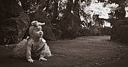 Ellianna joined the competition — help win amazing prizes! baby, child, crawling, garden, outdoors, portrait, sepia, vintage, bow, dress, infant, face, smiling, curious, rocks, pathway, trees, plants, nature, photography