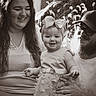 Ellianna is registered to the contest to win money with this photo: baby, child, toddler, family, portrait, smiling, happy, outdoor, garden, bow, dress, beard, glasses, woman, man, parents, seated, black_and_white, monochrome, celebration