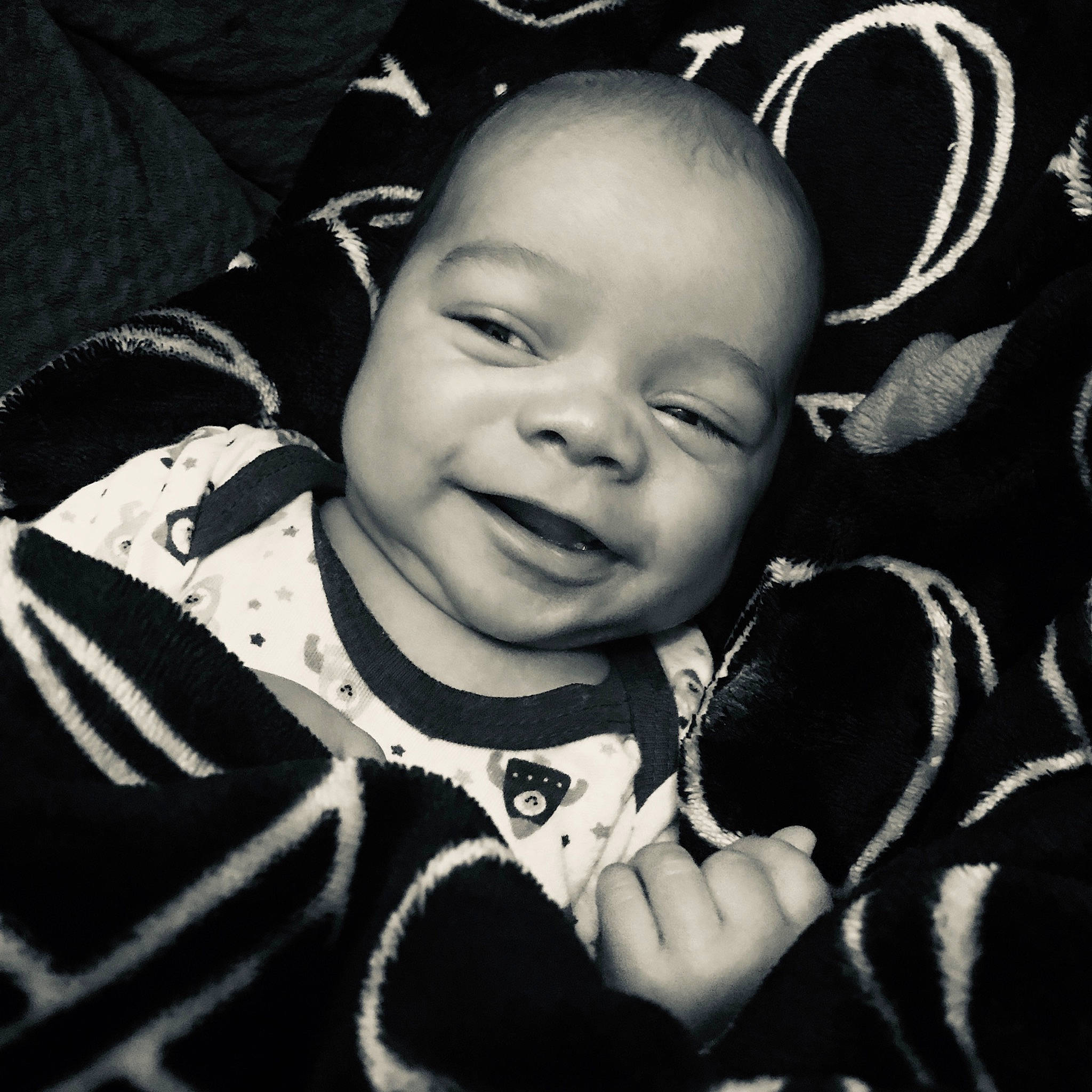 Kael is registered to the contest to win money with this photo: baby, black_and_white, cheek, child, cool, eye, face, facial_expression, happy, head, laugh, monochrome, person, photography, portrait_photography, smile, style, toddler