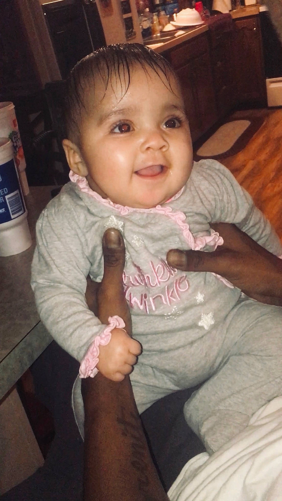 Kiyah is registered to the contest to win money with this photo: arm, baby, cheek, child, eye, face, finger, gesture, hand, head, leg, lip, mouth, nose, person, sitting, skin, smile, thumb, toddler