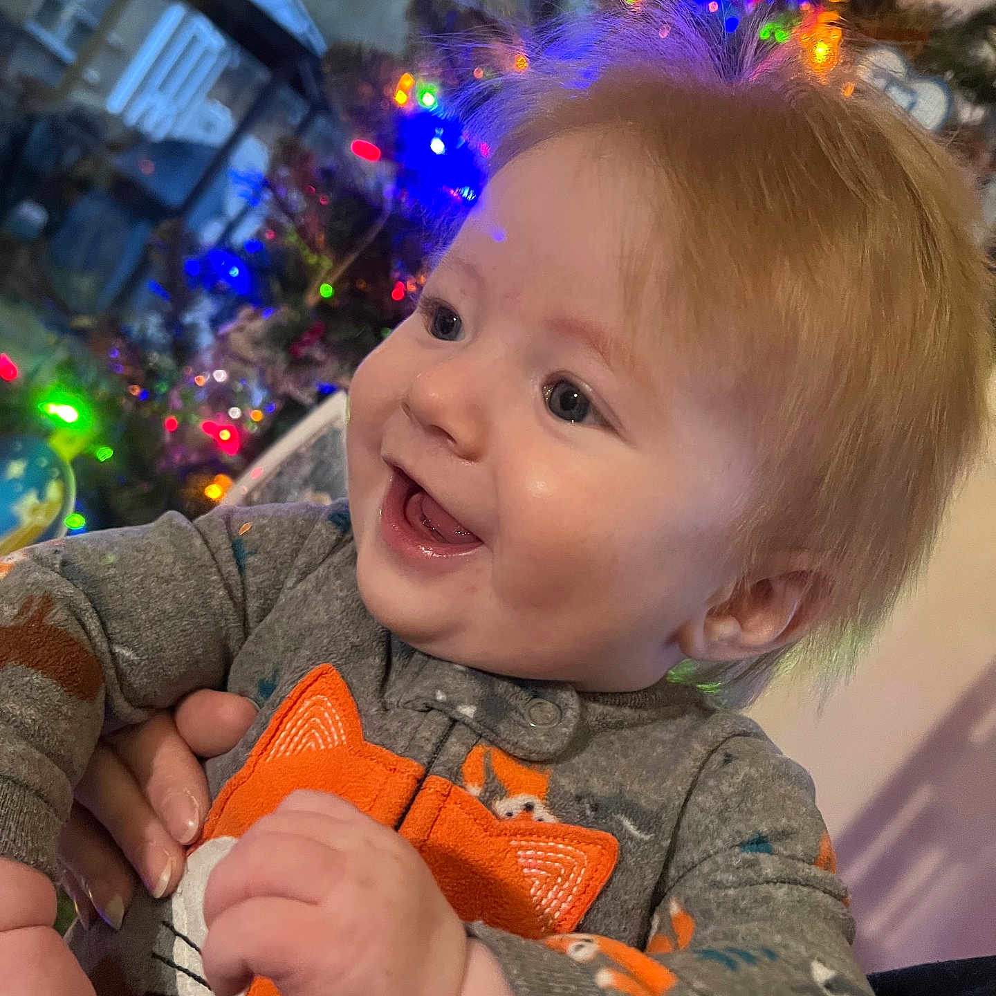 Morgan is registered to the contest to win money with this photo: baby, babylaughing, bodypart, clothing, coat, couch, face, festival, finger, furniture, hand, happy, head, laughing, lighting, person, photography, portrait, smile, urban