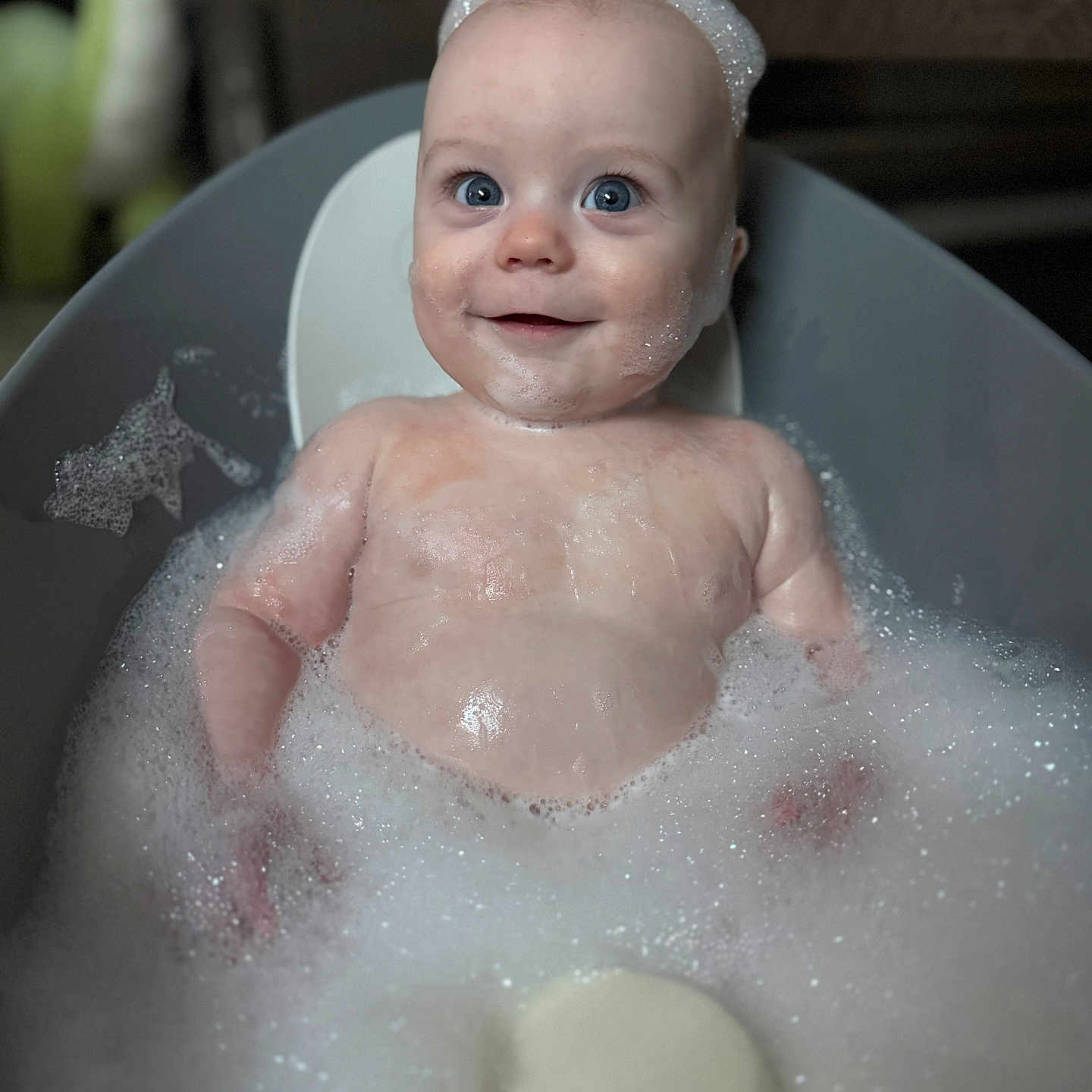Theo is registered to the contest to win money with this photo: baby, bathing, bathtub, bodypart, bubble, face, finger, foam, hand, happy, head, hottub, newborn, person, photography, portrait, smile, tub, washing
