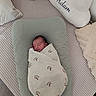 Adam a rejoint le concours — aidez-le/la à gagner de superbes lots ! newborn, baby, swaddled, blanket, cushion, bed, pillow, sleeping, infant, resting, cozy, fabric, textile, soft, indoors, peaceful, decor, child, person, nap