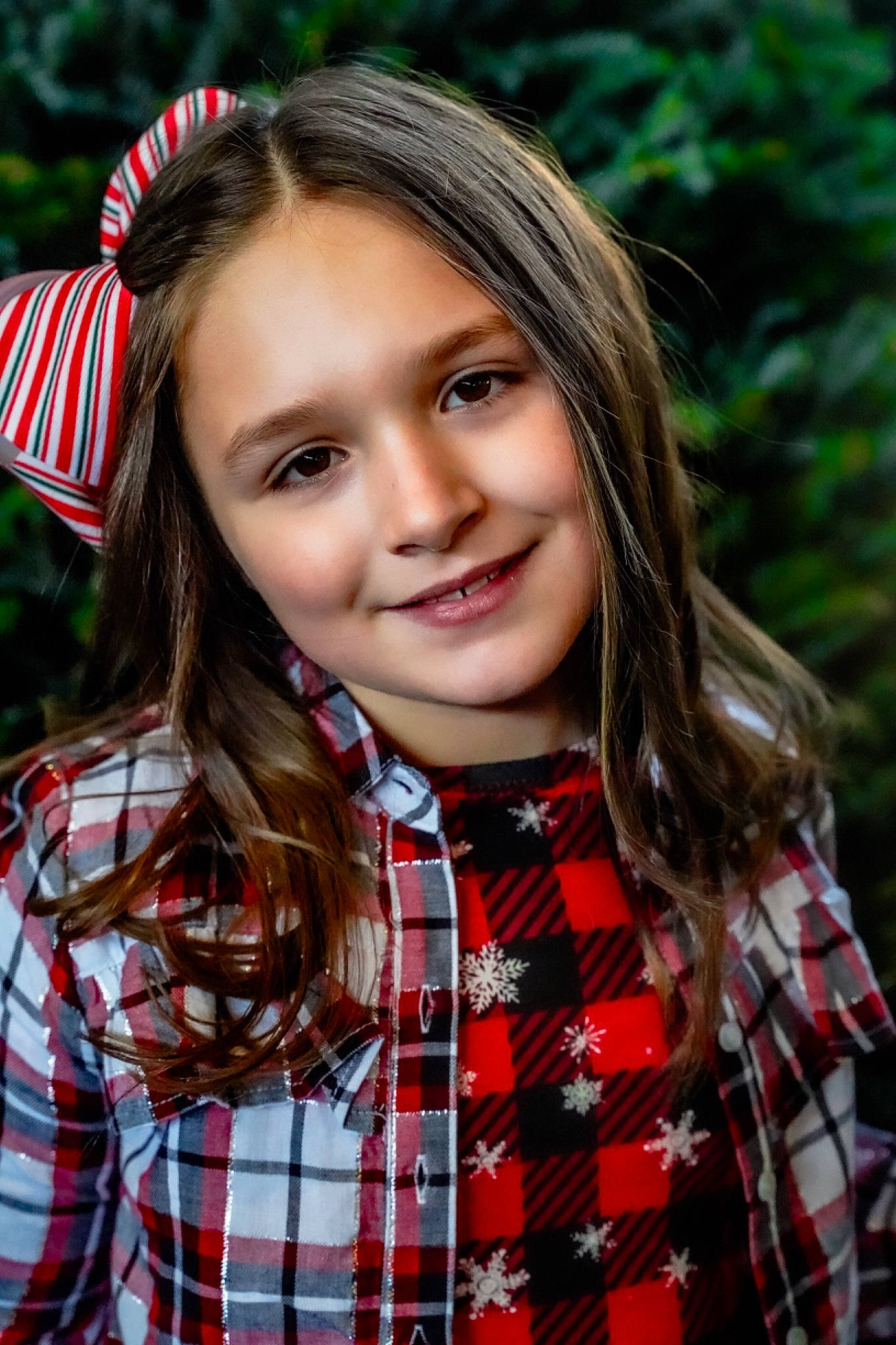 Amya is registered to the contest to win money with this photo: brown_hair, child, collar, eye, face, flash_photography, grass, happy, head, joy, lip, long_hair, outerwear, pattern, people_in_nature, person, plaid, red, smile, tartan