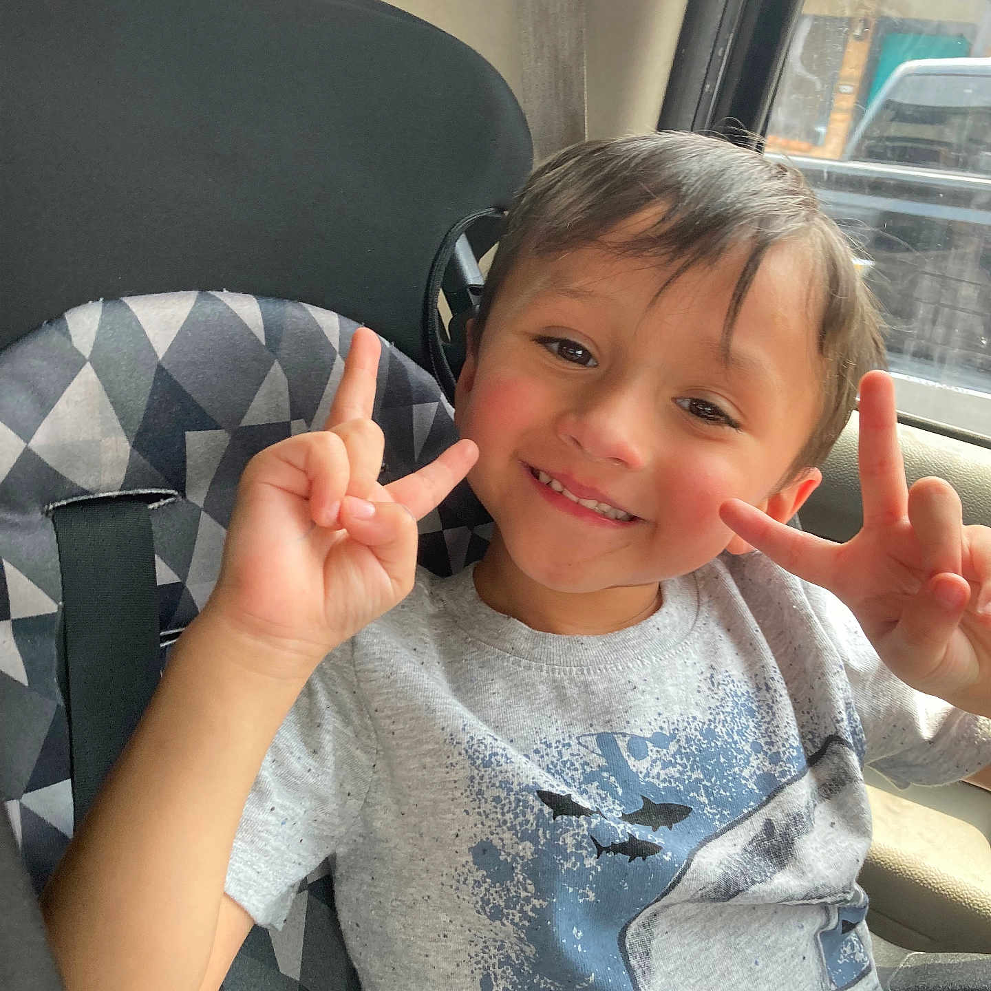 Jesse is registered to the contest to win money with this photo: baby, bodypart, car, car_interior, clothing, cushion, face, finger, hand, happy, head, homedecor, person, photography, portrait, sitting, smile, t_shirt, transportation, vehicle