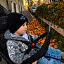 Loris participe au concours pour gagner de l'argent avec cette photo : autumn, baby, beanie, casual, child, curious, daylight, hat, jeans, knit_sweater, leaves, outdoor, parked_cars, portrait, sidewalk, street, stroller, toddler, urban, warm_clothing