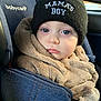baby, child, car_seat, beanie, hat, jacket, clothing, face, blue, denim, warm, cute, infant, portrait, young, person, seat, window, expression, indoor