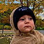 Loris participe au concours pour gagner de l'argent avec cette photo : toddler, child, baby, hat, beanie, fuzzy_clothing, autumn, fall, leaves, outdoor, portrait, person, cute, warm_clothing, nature, seasonal, face, expression, park, casual