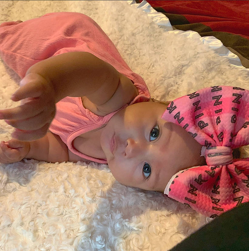 Galilea is registered to the contest to win money with this photo: baby, cheek, child, eye, headwear, lip, mouth, person, pink, skin, toddler