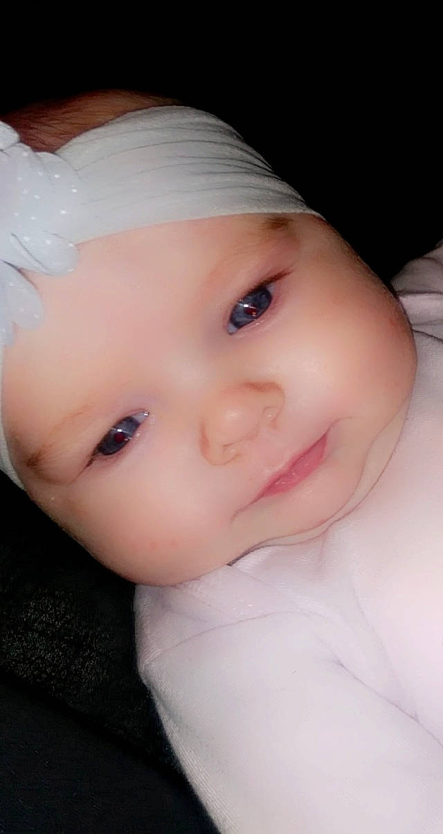 Ariel joined the competition — help win amazing prizes! baby, baby_toddler_clothing, cap, cheek, chin, dress, eye, eyebrow, eyelash, flash_photography, happy, headgear, headwear, iris, lip, nose, person, pink, skin, sleeve