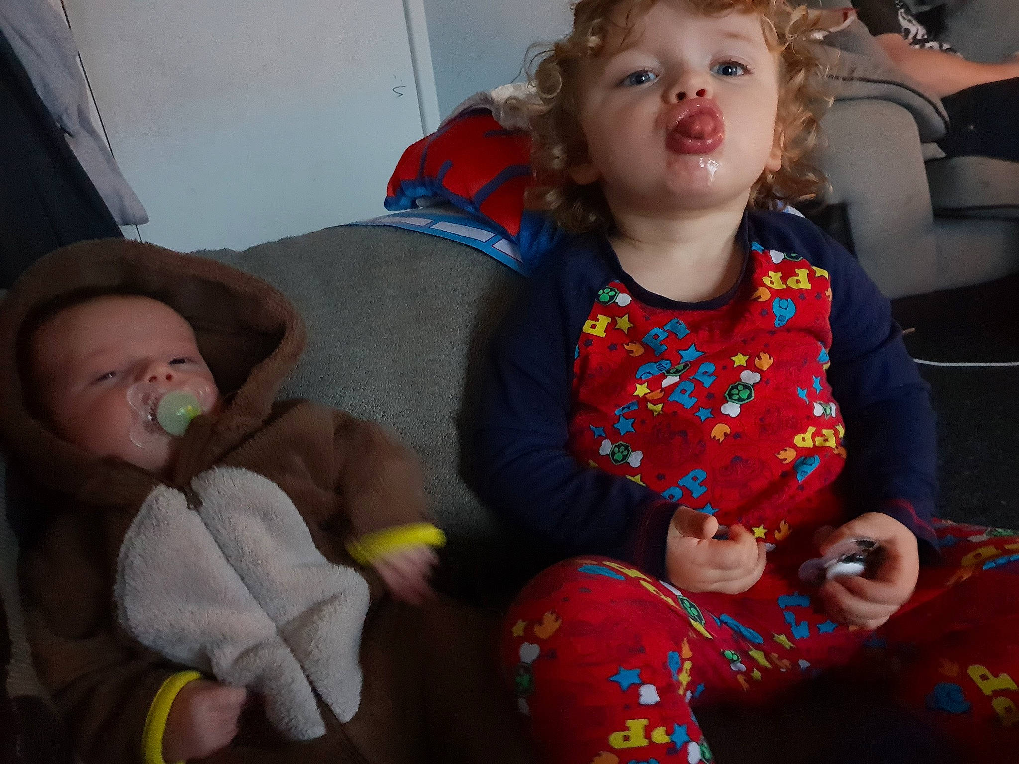 Logan is registered to the contest to win money with this photo: baby, cheek, child, eye, finger, fun, grandparent, iris, person, play, sitting, smile, toddler