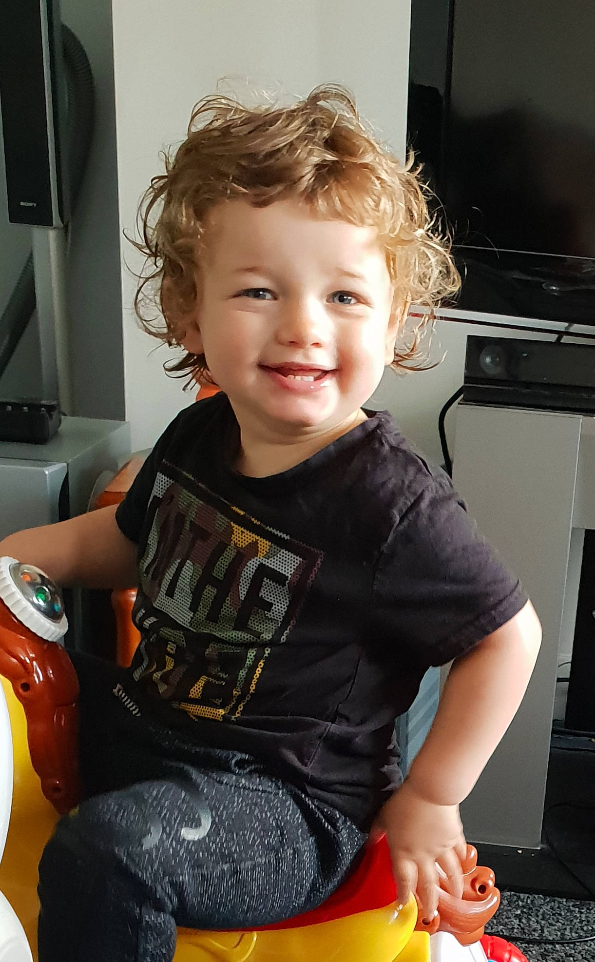 Logan joined the competition — help win amazing prizes! arm, child, joy, leg, person, sitting, smile, t_shirt, toddler