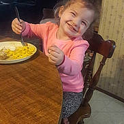 Jayden joined the competition — help win amazing prizes! child, girl, smile, happy, fork, food, plate, table, chair, pink_shirt, leopard_print, indoor, kitchen, wooden_furniture, meal, dining, cute, casual_clothing, person, young_child