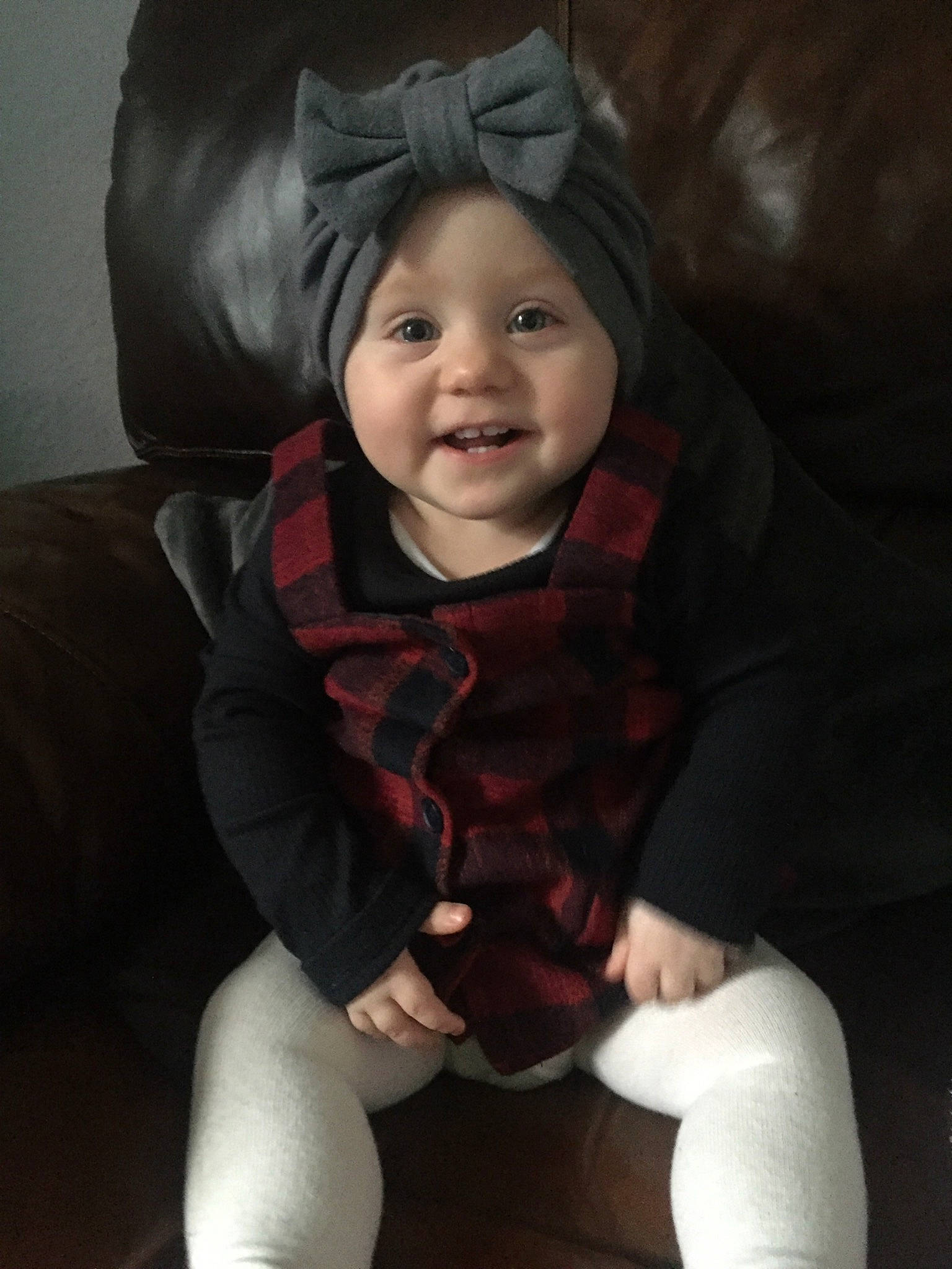 Eliza is registered to the contest to win money with this photo: baby, baby_toddler_clothing, cheek, comfort, eye, face, flash_photography, happy, head, headwear, human_body, iris, joy, knee, lip, mouth, neck, outerwear, person, sleeve