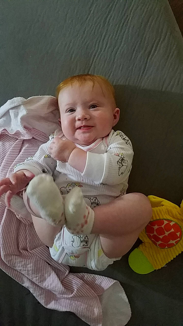 Averie B. is registered to the contest to win money with this photo: abdomen, baby, baby_toddler_clothing, cheek, child, comfort, eye, finger, happy, human_body, leg, people, person, pink, skin, sleeve, smile, stomach, thumb, toddler