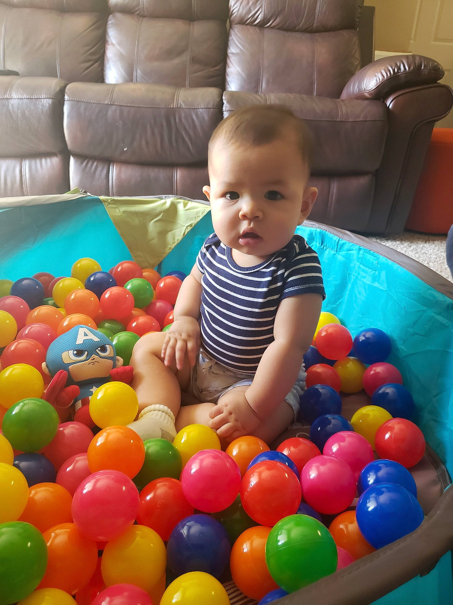 Sebastian is registered to the contest to win money with this photo: baby_playing_with_toys, ball_pit, child, person, play, toddler, toy