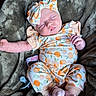 baby, sleeping, infant, headband, pacifier, blanket, soft, plush, clothing, patterned, orange, socks, cute, resting, peaceful, newborn, cozy, portrait, child, indoor
