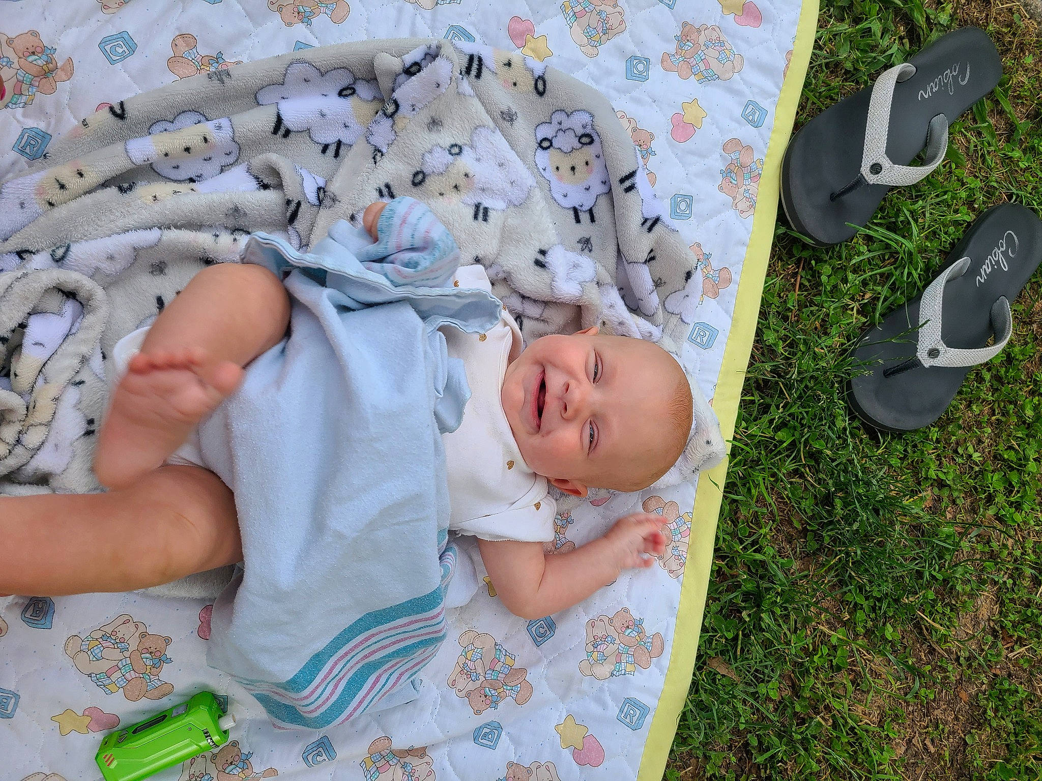 Ember is registered to the contest to win money with this photo: baby, baby_products, baby_sleeping, baby_toddler_clothing, child, comfort, foot, grass, linens, pattern, person, sitting, sleep, sock, toddler