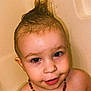 toddler, child, bathtub, water, wet_hair, mohawk, necklace, beads, smiling, face, skin, indoors, bath, cute, playful, young_child, portrait, head, shoulders, happy