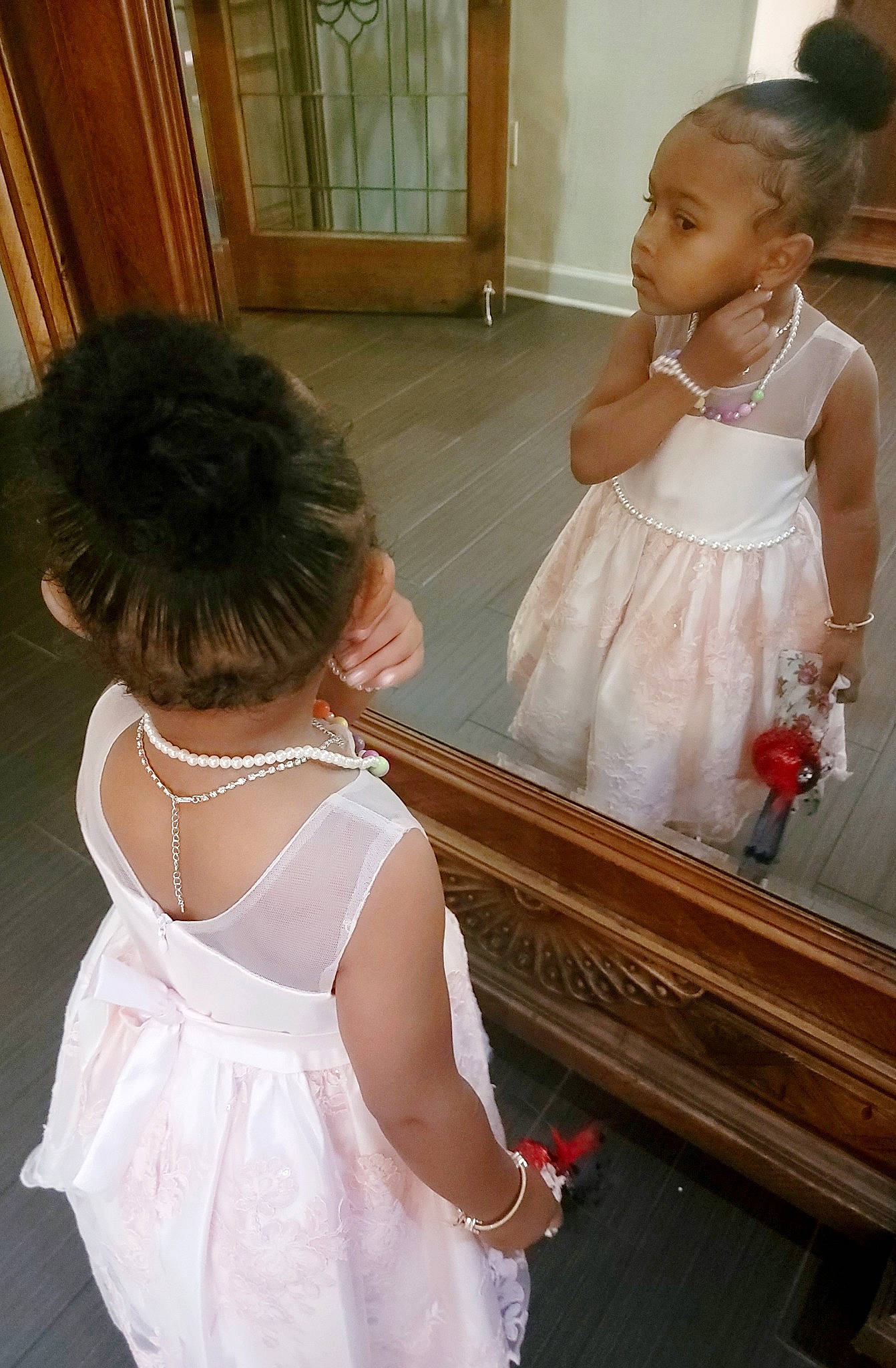 Alayah is registered to the contest to win money with this photo: bridal_accessory, bridal_clothing, dress, embellishment, flash_photography, flooring, fun, gown, hair, hairstyle, happy, human_body, interaction, joint, neck, person, shoulder, skin, standing, wedding_dress