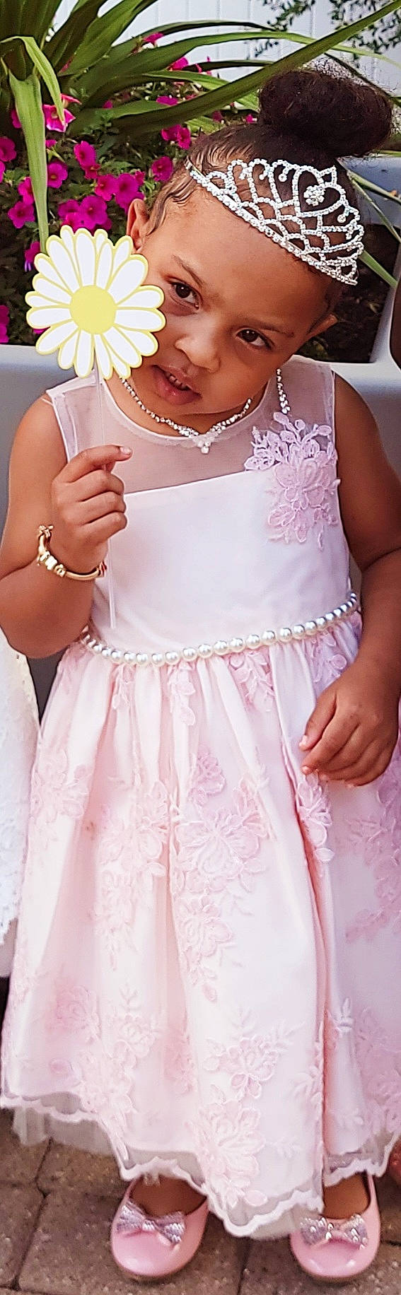 Alayah is registered to the contest to win money with this photo: arm, clothing, day_dress, dress, embellishment, finger, gesture, gown, hand, happy, hat, headwear, joint, neck, one_piece_garment, person, pink, shoulder, skin, sleeve