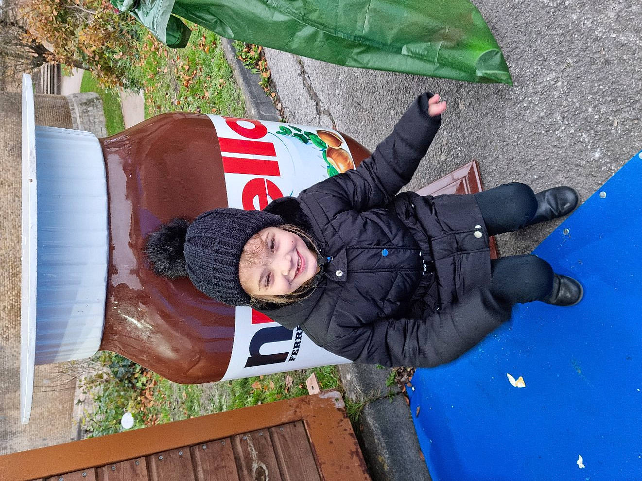 Lucie participe au concours pour gagner de l'argent avec cette photo : asphalt, child, electric_blue, fun, gas, glove, grass, green, headwear, jacket, joy, person, photograph, plant, public_space, red, road_surface, smile, soil, toddler