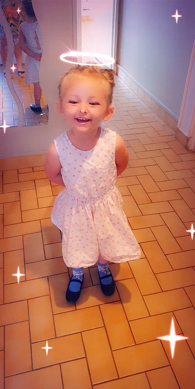 Marie participe au concours pour gagner de l'argent avec cette photo : baby_toddler_clothing, beauty, dress, face, floor, flooring, fun, hair, happy, head, joy, leg, lighting, person, pink, purple, red, skin, sleeve, smile