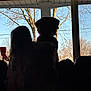 Pretzel is registered to the contest to win money with this photo: backlit, bare_tree, child, companionship, couch, daylight, dog, friendship, furniture, home, indoor, nature, pet, quiet, relaxation, shadow, silhouette, sky, tree, window