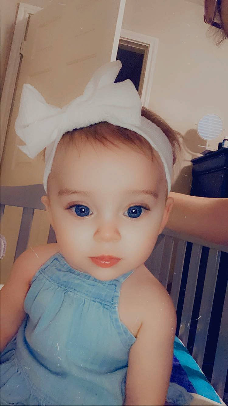 Abigail is registered to the contest to win money with this photo: baby_toddler_clothing, bridal_accessory, cheek, chin, doll, dress, ear, electric_blue, eye, eyebrow, eyelash, headband, headgear, headpiece, iris, lip, person, pink, skin, toy