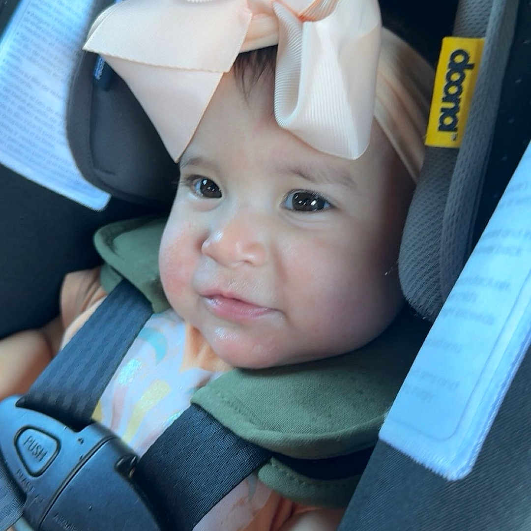 Augustina joined the competition — help win amazing prizes! adorable, baby, bow, car, car_seat, child, closeup, cute, expression, face, headband, infant, pink, portrait, safety, seat, seatbelt, sitting, straps, young_child