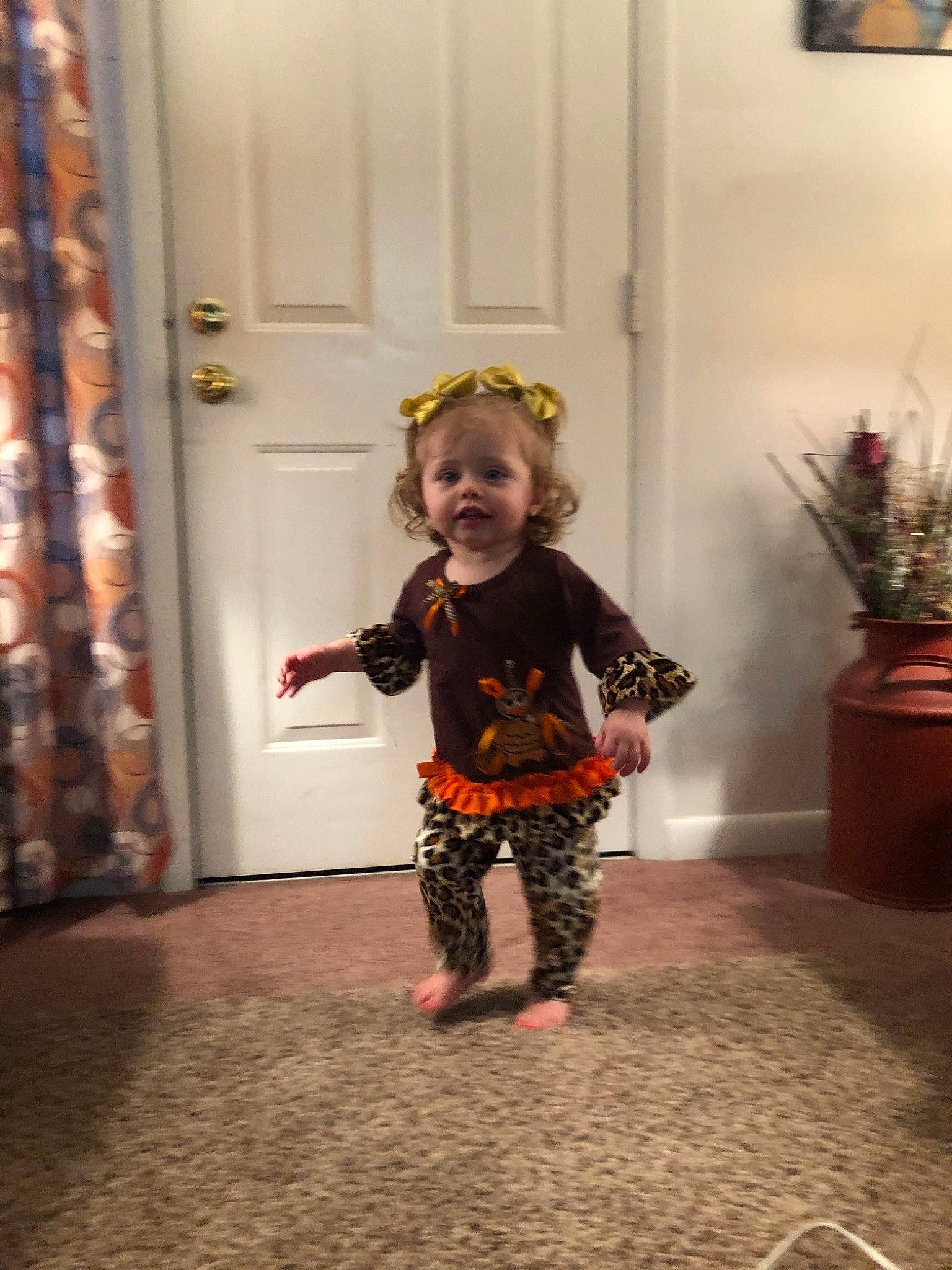 Adilynn joined the competition — help win amazing prizes! child, costume, dress, fawn, floor, flooring, person, room, shoe, standing, toddler, tree