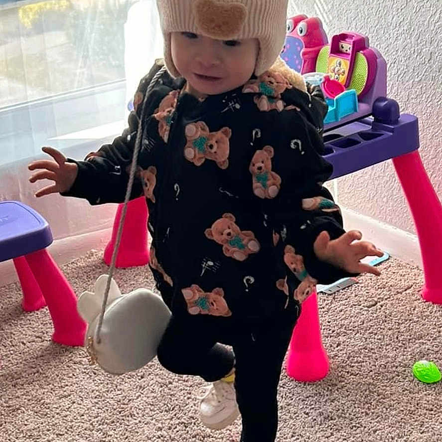 Genesis joined the competition — help win amazing prizes! baby, ball, bathroom, cap, clothing, face, footwear, hat, head, indoors, person, photography, portrait, room, shoe, sitting, sport, tennis, tennisball, toilet
