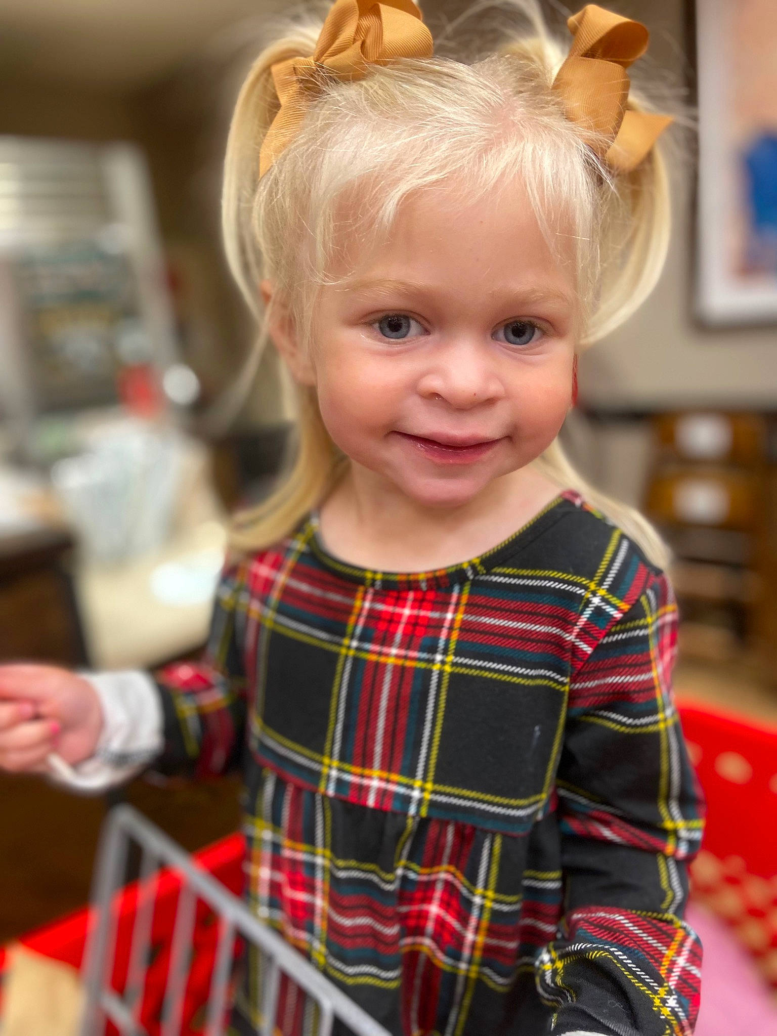 Charlotte is registered to the contest to win money with this photo: baby_toddler_clothing, bangs, blond, cheek, child, christmas, costume_hat, design, face, fun, happy, head, joy, pattern, person, plaid, room, sleeve, smile, t_shirt