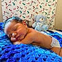 baby, bed, bedroom, blanket, cushion, face, furniture, head, homedecor, indoors, newborn, person, photography, portrait, quilt, room, sleeping, spa, teddybear, toy
