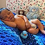 animal, baby, bed, bedroom, bird, blanket, cushion, face, furniture, head, homedecor, indoors, newborn, person, photography, portrait, quilt, sleeping, teddybear, toy