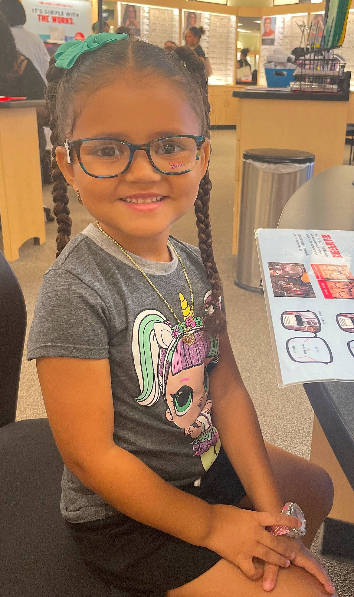 Kiari joined the competition — help win amazing prizes! artist, chair, child, cool, design, event, eyewear, finger, forehead, fun, glasses, happy, joy, person, room, sitting, smile, snapshot, t_shirt, toddler