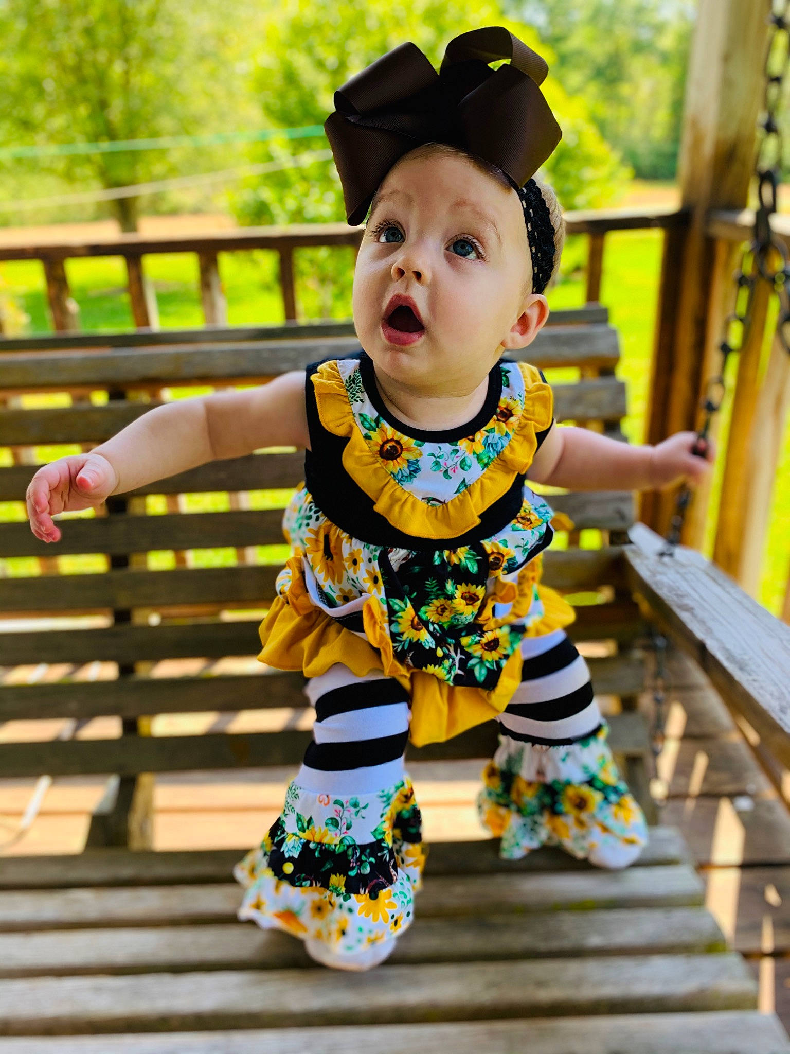 Kayzlen joined the competition — help win amazing prizes! baby_toddler_clothing, child, leaf, pattern, person, ruffle, smile, surprise, textile, toddler, yellow